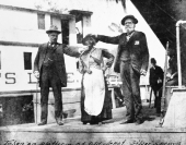 Aunt Scilla standing beside the "Astatula" at the Silver Springs dock - Florida