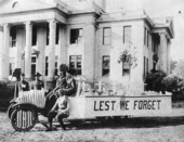 Veterans with Armistice Day parade float in front of the Jefferson County courthouse.