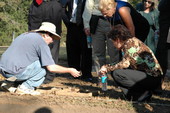 Mission San Luis archaeologist Jerry Lee showing work to Senate Committee on Governmental Oversight and Productivity tour members - Tallahassee, Florida.