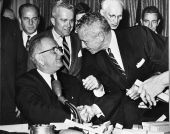 Former Florida Governor LeRoy Collins with President Lyndon B. Johnson during ceremony marking passage of the Civil Rights Act.