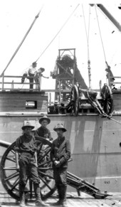 Cannons being loaded on transport preparing to sail to Cuba for the Spanish-American war - Tampa, Florida.