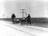 Field workers traveling with baby and possessions