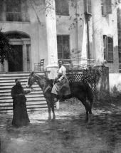 Ellen Call Long leads a horse ridden by a lady in front of "The Grove" - Tallahassee, Florida.