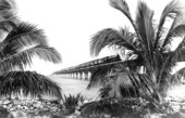 F. E. C. Railway northbound passenger train traveling along Overseas Extension bridge at Pigeon Key.