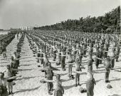 Soldiers performing training exercises on the beach during WWII - Miami Beach, Florida.