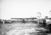 Crowd gathered around a biplane, part of Mabel Cody's Flying Circus - Coral Gables, Florida.