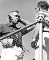 UF football coach Graves testing portable telephone - Gainesville, Florida.