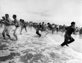 Segregationists trying to prevent blacks from swimming at a "White only" beach in St. Augustine.