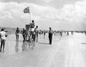 White peace officer, right, standing by the lifesaving station at Butler Beach - Anastasia Island, Florida.