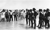 Confrontation between integrationists and segregationists at a whites-only beach in St. Augustine.