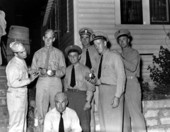 Ted Williams signing a baseball for Navy personnel - Panama City, Florida