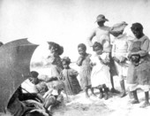 African American children with dog on the beach - Apalachicola, Florida.