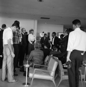 Rev. John Collier from Newark, N.J. (wearing bow tie), speaking with police as the "Tallahassee Ten" are arrested at the airport.