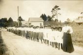 Mary McLeod Bethune with a line of girls from the school