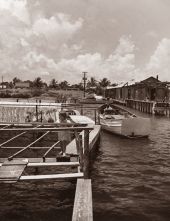 View of nets, fishing boat and fish house at the docks - Riviera Beach, Florida.