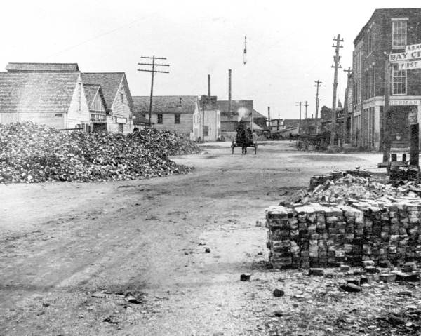 Street scene with oyster shell piles--Apalachicola, Florida.